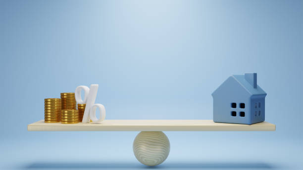 istock 3d rendering. gold coins stack and home on weigh scale on blue background. investment property concept. 1448047024