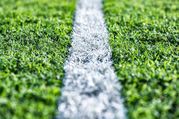 istock A low angle view of a single white sports chalk line on grass 1448047371