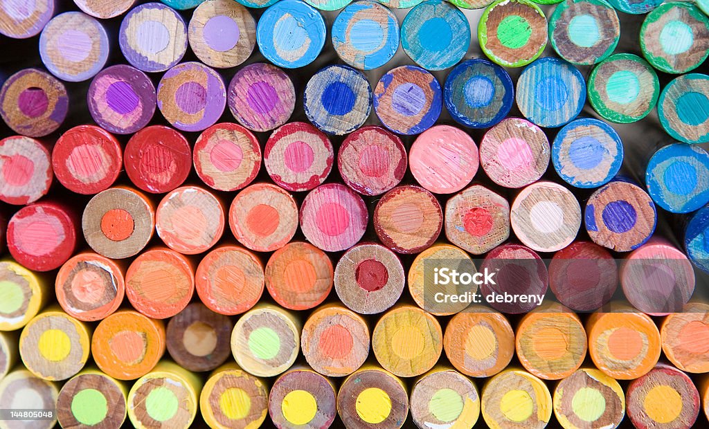 pencil crayon macro rainbow of pencil crayons - macro Checking the Time Stock Photo