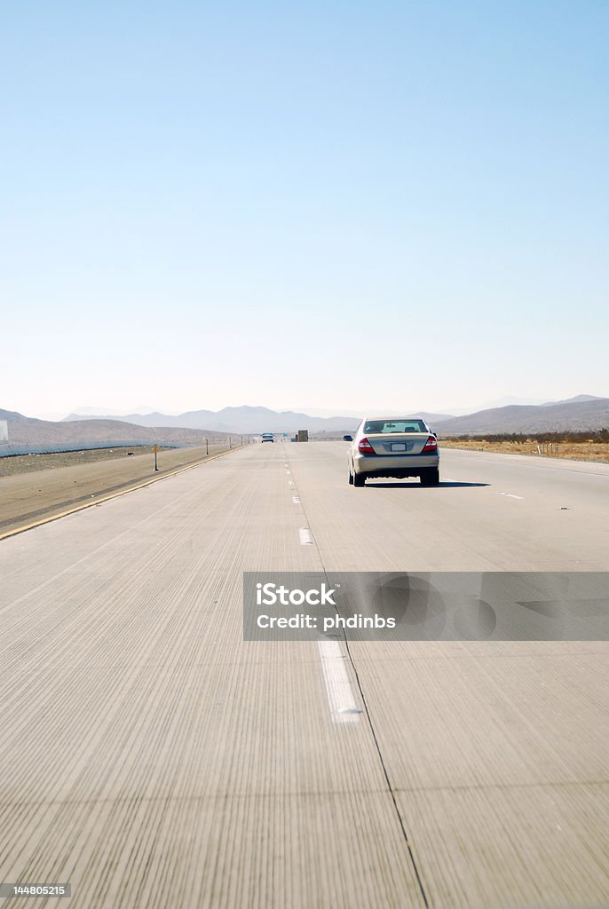 Highway Grooves Interstate 15 heading west from Las Vegas, Nevada to Los Angeles, California.  Road grooves are engineered to drain rain water off of the highway for a safer drive. Car Stock Photo