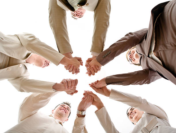 istock Team of business people holding hands 144805413