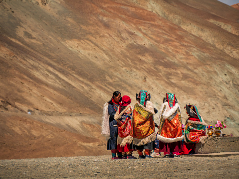 Ladakh, India - June 23,2022: Group of Ladakhi females in traditional attire Goucha.