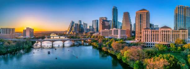 istock Austin, Texas- Panoramic cityscape and Colorado River against the sunset sky 1448057680
