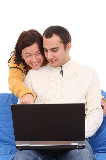 istock happy couple with laptop 144805931