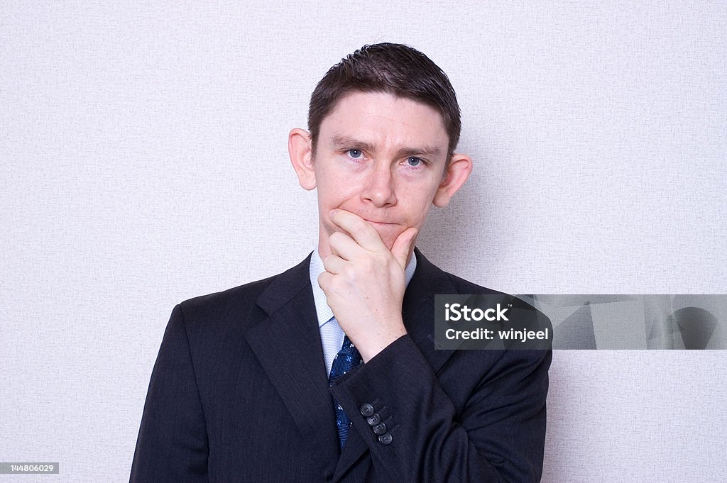 Let me think for a moment... Man thinking, considering, choosing, or even disappointed Adult Stock Photo