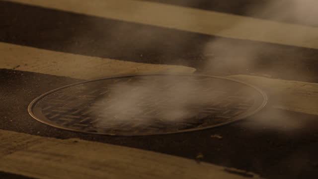 City Street Manhole Steam