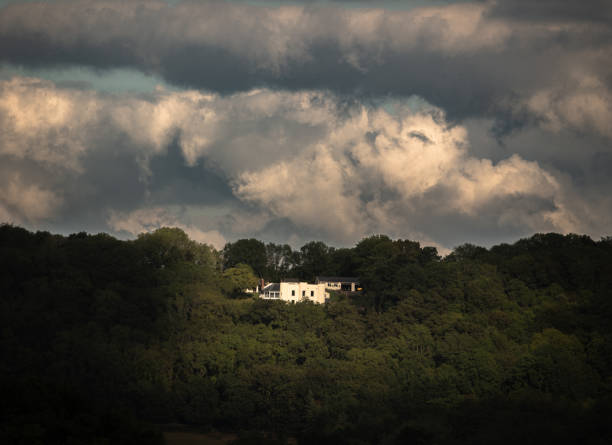 Blue sky and a small house on the horizon, outdoor shot