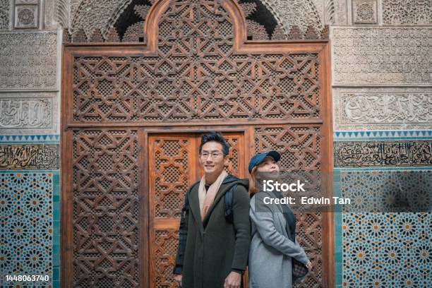 Portrait Asian Chinese Tourist Couple Standing At Fez Mosque Bou Inania Madressa Stock Photo - Download Image Now