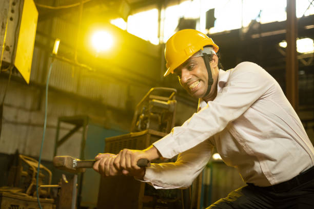 istock Indian engineer or worker working in industrial factory. Low angle shot. 1448067288