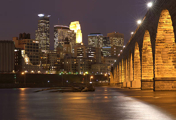 istock Minneapolis skyline at dusk with the Stone Arch Bridge 144806888
