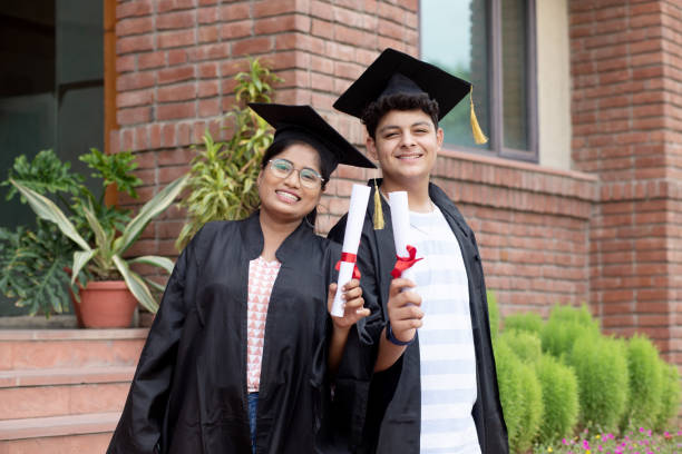 istock Happy young indian graduated students holding his graduation degree convocation ceremony. 1448069287