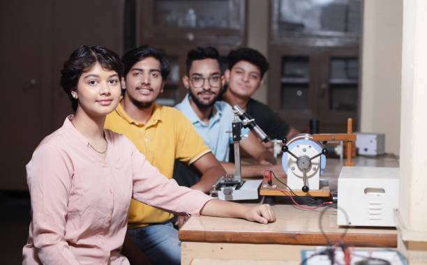 istock Group of indian students working or experimenting in science lab. 1448069413