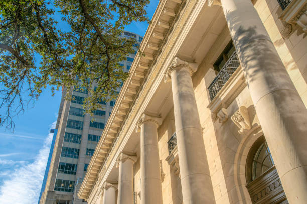 istock Austin, Texas- Ancient roman and high-rise buildings in a low angle view 1448071163