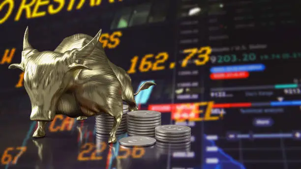 Photo of The golden bull and coins on business background 3d rendering