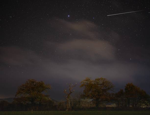 istock Shooting star over Somerset landscape 1448072330