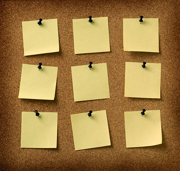 istock nine yellow notes pinned to grunge cork background 144807271