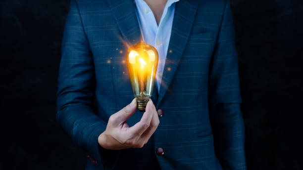 istock Bright idea in hand Business man,Hands holding light bulb for concept new idea concept with innovation and inspiration,technology in science and communication concept 1448074411