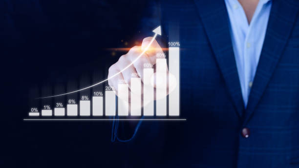 istock Businessman showing business growth on graph Hands touching graphs representing increasing profits, financial symbols coming 1448074447