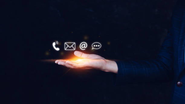 istock Contact us or Customer support hotline people connect. Businessman using showing and touching on virtual screen contact icons ( call phone, email, address, live chat, ) 1448074472
