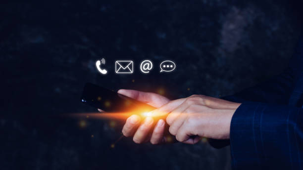 istock Customer support hotline Contact us people connection, Businessman using pointing touching Smart Phone with email, call phone, address, Chat message icons, Communication concept 1448074474