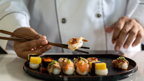 istock Chef cooking sushi in the kitchen 1448078155