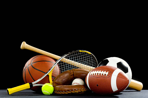 Sports equipment with rackets and balls Misc. Sports equipment on a black background with copy space above sports equipment stock pictures, royalty-free photos & images