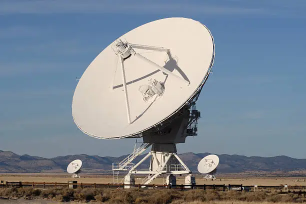 A trio of radiotelescope dishes at the Very Large Array, the National Radio Observatory on the high plains of western New Mexico.