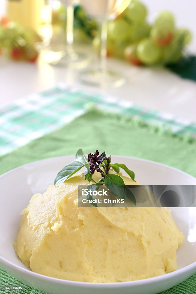 Mash potato Mash potato with basil heaped up and smoothed off in a white ceramic bowl Basil Stock Photo