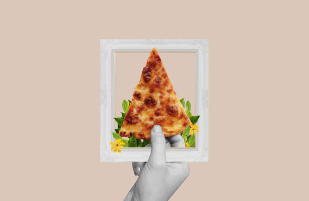 istock Digital collage, Hand holding slice of pizza 1448086139