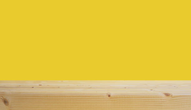 istock selective focus.Empty of wood table top on yellow pastel color background. 1448086195