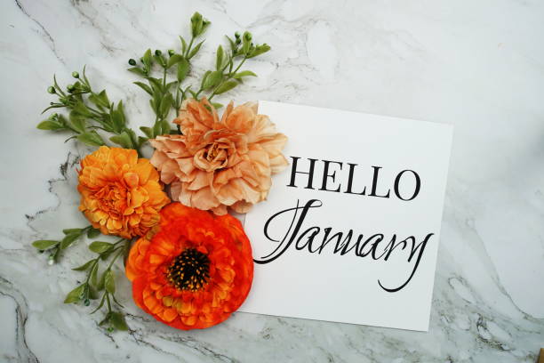 istock Hello January text with orange flower bouquet on marble background 1448087089