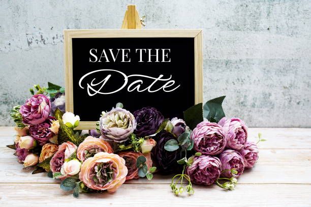istock Save the Date typography text with Flower bouquet on wooden background 1448087198