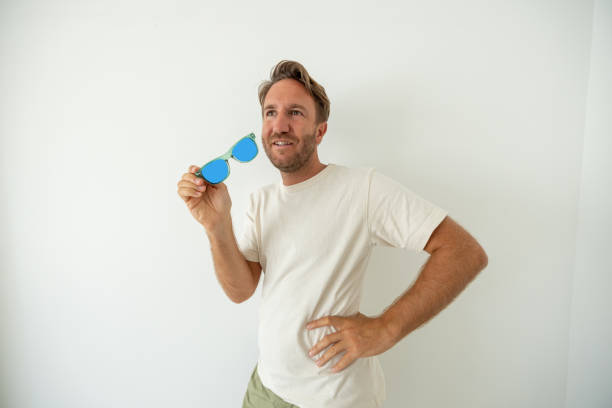 istock Portrait of fun man against white background 1448087246