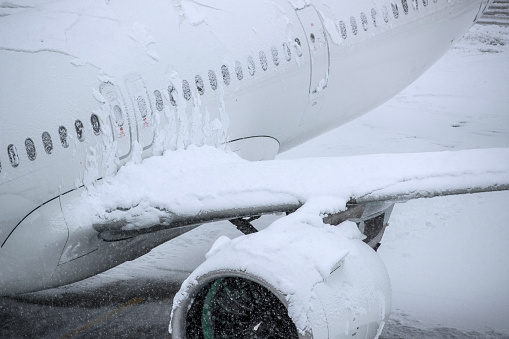Aircraft covered with snow on a winter day