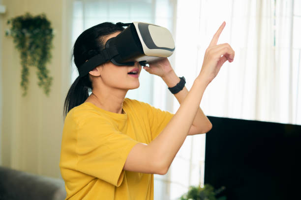 istock Asian woman experiencing virtual reality eyeglasses headset. VR Metaverse concept. new technology futuristic lifestyle 1448088376
