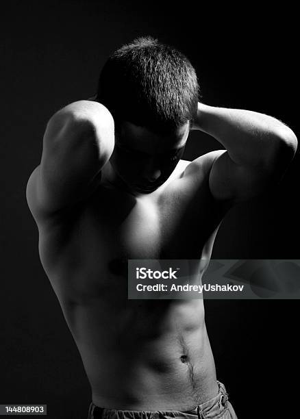 Bw Young Sporty Man Over Black Background Stock Photo - Download Image Now - Abdomen, Active Lifestyle, Activity