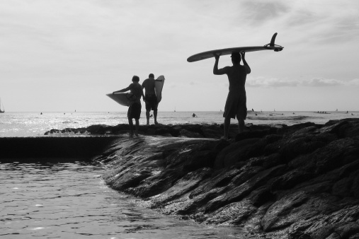 Hawaiian Surfers on Waikiki Beach, Oahu.