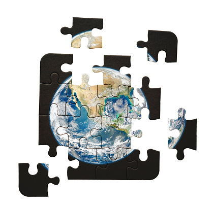 Satellite image of the Earth on a jigsaw puzzle. Public domain Earth image from https://www.nasa.gov/multimedia/imagegallery/image_feature_2159.html