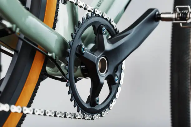 Photo of The leading star of a bicycle with a connecting rod and a chain close-up