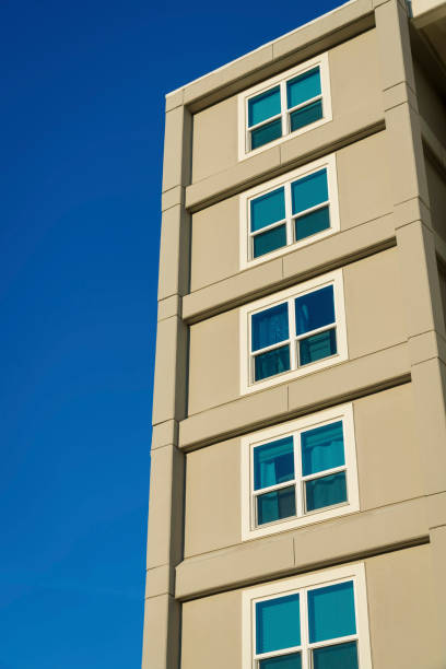 istock Building exterior with square paned windows in a low angle view at Destin, Florida 1448092528