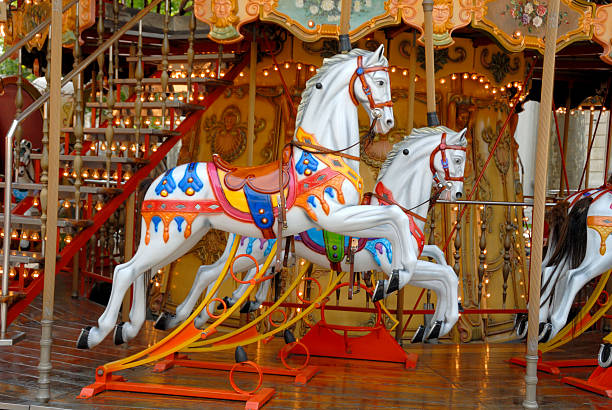 istock Carousel horses in white on poles 144809371