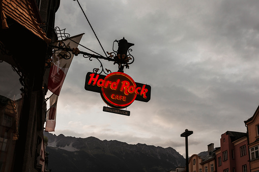 innsbruck, Austria - August 17th, 2022: Hard Rock Cafe neon board and lights in the shop of Innsbruck, Austria