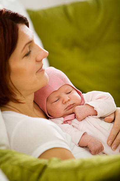 istock Newborn baby relaxing with its mother  144809889