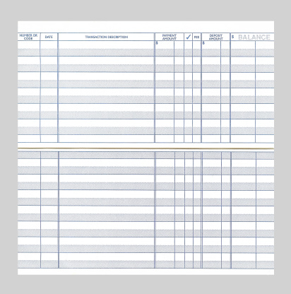 A blank checkbook register isolated on a gray background.