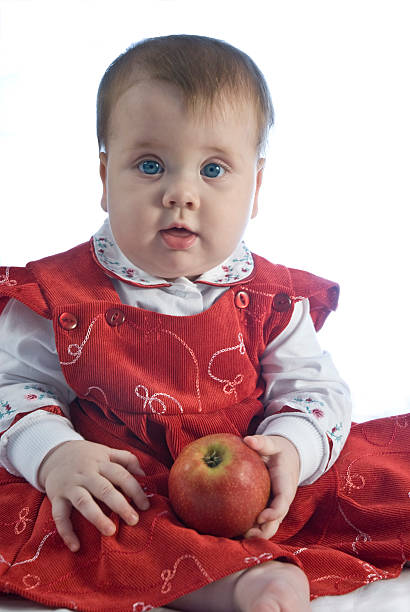 Girl with apple stock photo