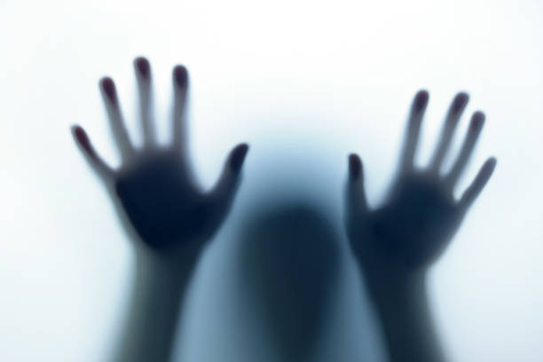 istock Blurred shadow in blue light outside the door. The concept of nightmares, ghosts, horror, paranormal 1448100547