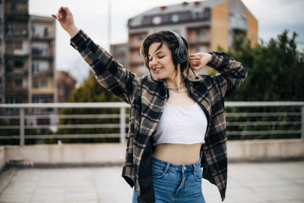 istock Young girl is dancing on the rooftop 1448102679