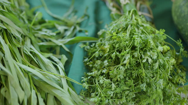 Green leafy vegetables on a market stall.