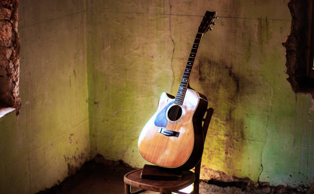 istock a classical guitar on a chair in the ruins 1448104092