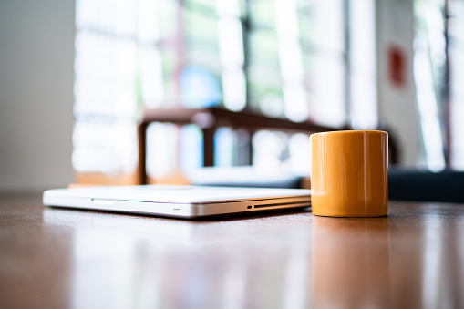 Laptop and mug on the desk